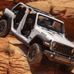 The 2026 Jeep Wrangler crawling down rocky terrain