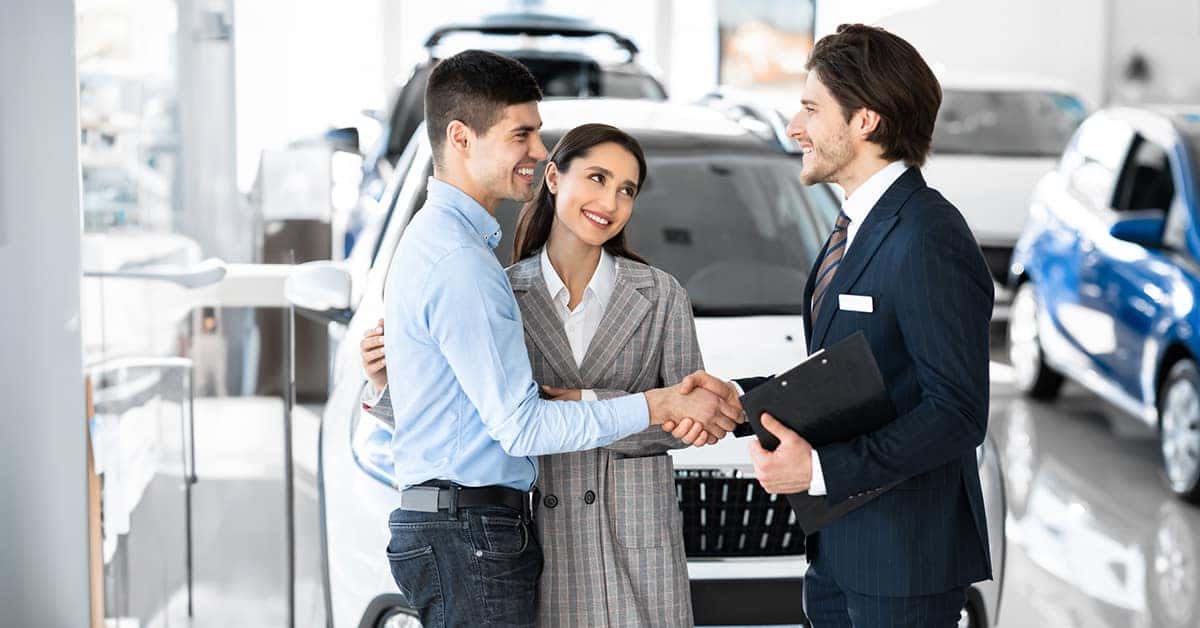 sales-rep-shaking-hands-with-dealership-customer