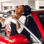Woman shopping for used cars under $25,000