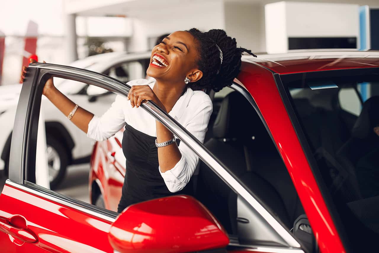 Woman shopping for used cars under $25,000