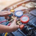 Jeep service technician testing an A/C system
