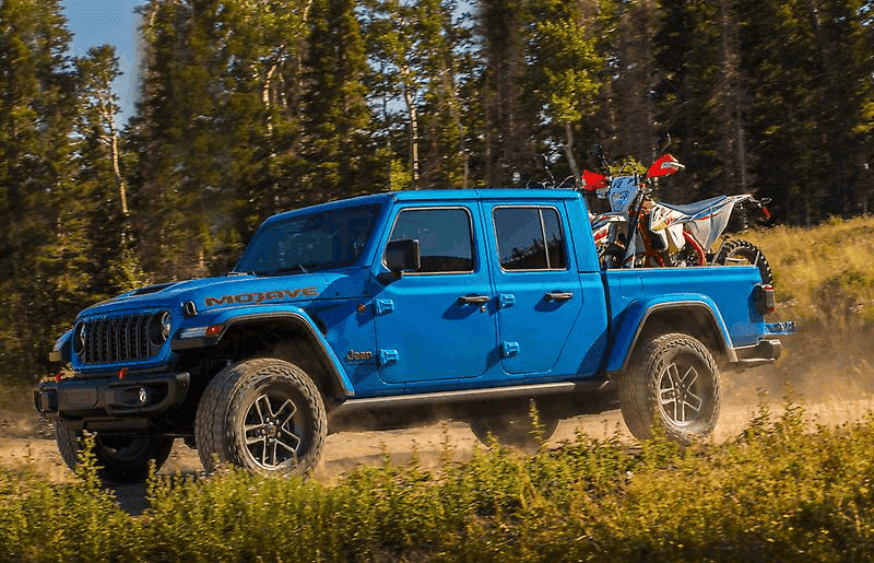 2026 Jeep Gladiator with a dirtbike on its truck bed