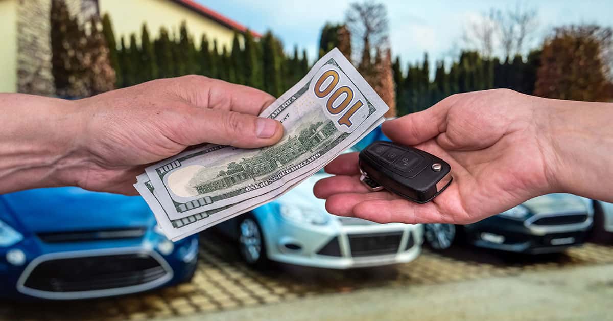 Exchanging cash and keys as part of a Jeep trade-in