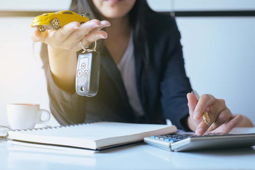 Person working with Jeep leasing materials