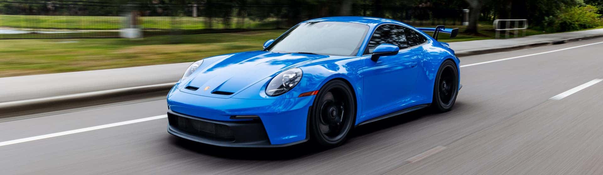 Front of Blue Porsche Sedan
