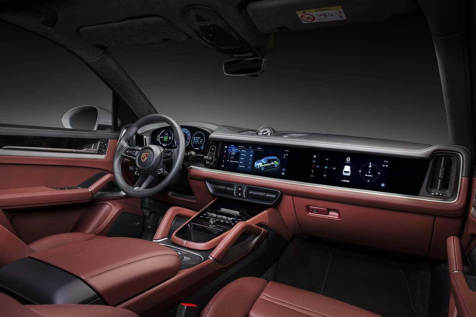 red leather interior of a porsche cayenne showcasing the advanced technology
