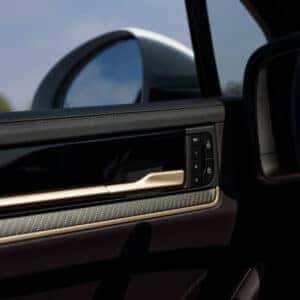 the interior driver's side door of a porsche cayenne suv