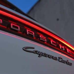 the rear exterior of a porsche cayenne showcasing the rear lights and cayenne emblem