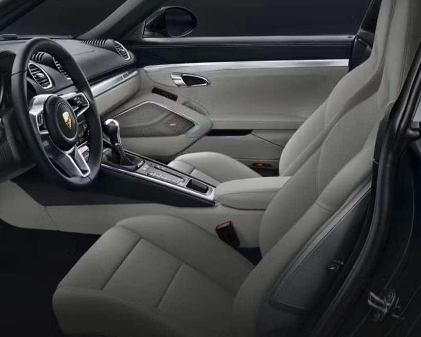 the side profile of the front interior in gray of a 2025 porsche 718 cayman