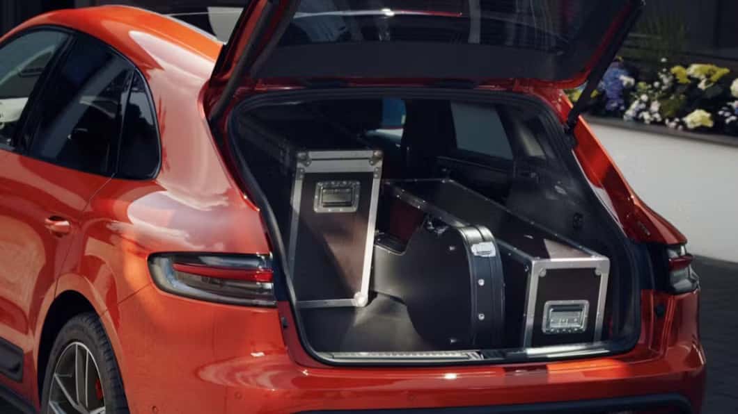 a red macan s showcasing the luggage compartment