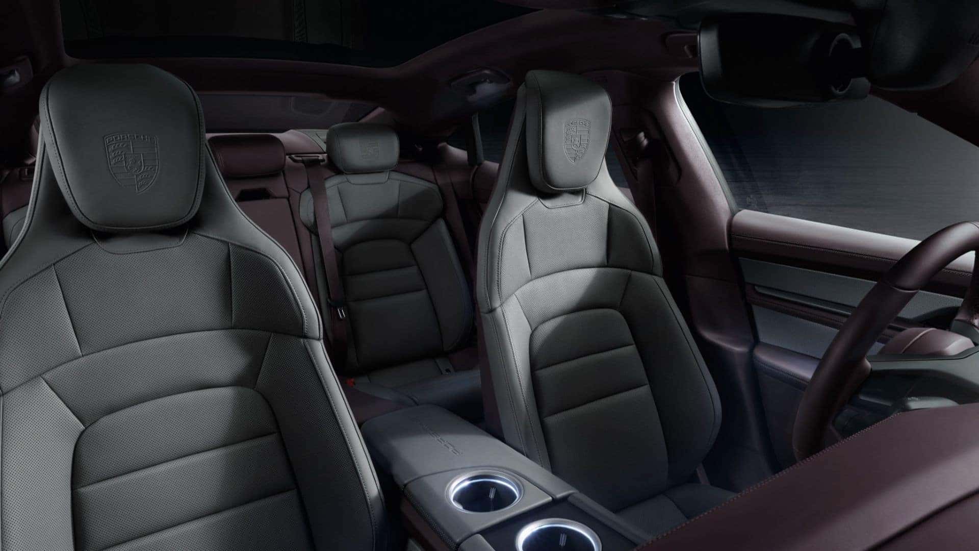 interior of a 2025 porsche taycan with gray and maroon interior suede
