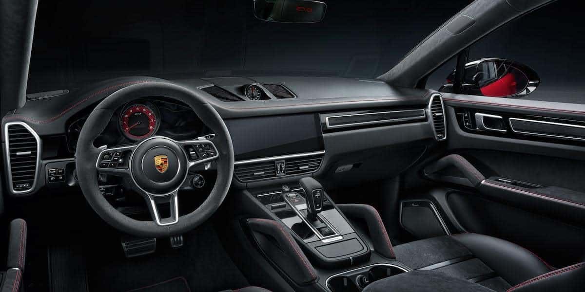 Interior of the Porsche Macan, showcasing its luxurious design, modern technology, and ergonomic driver-focused cockpit.