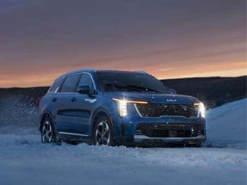 2025 KIA Sorento Hybrid parked in the snow at sundown
