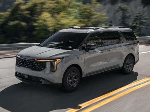 2025 Kia Carnival MPV Hybrid driving on a highway