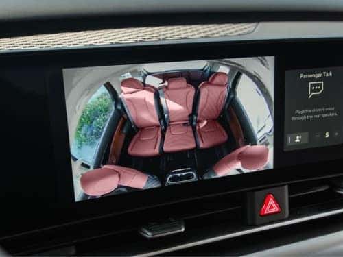 2025 Kia Carnival MPV Hybrid rear seat view on touchscreen with passenger view camera 