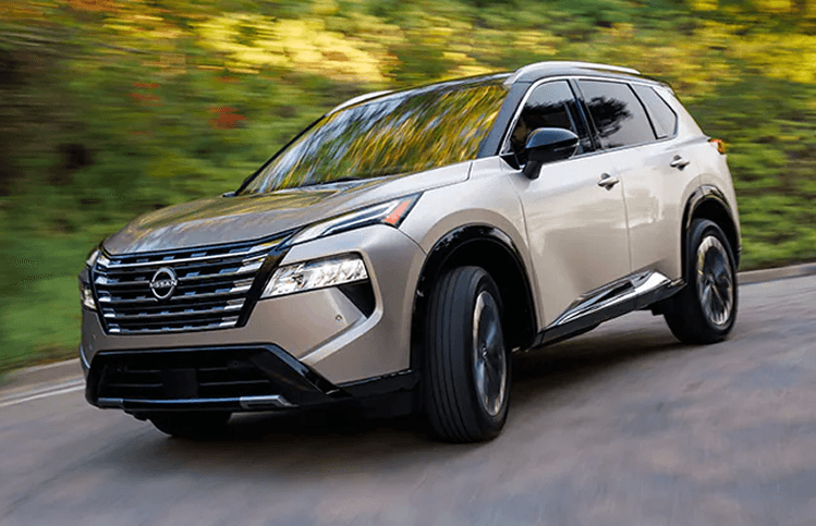 Nissan Rogue driving down the road
