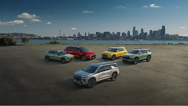 Chevy vehicles in front of skyline