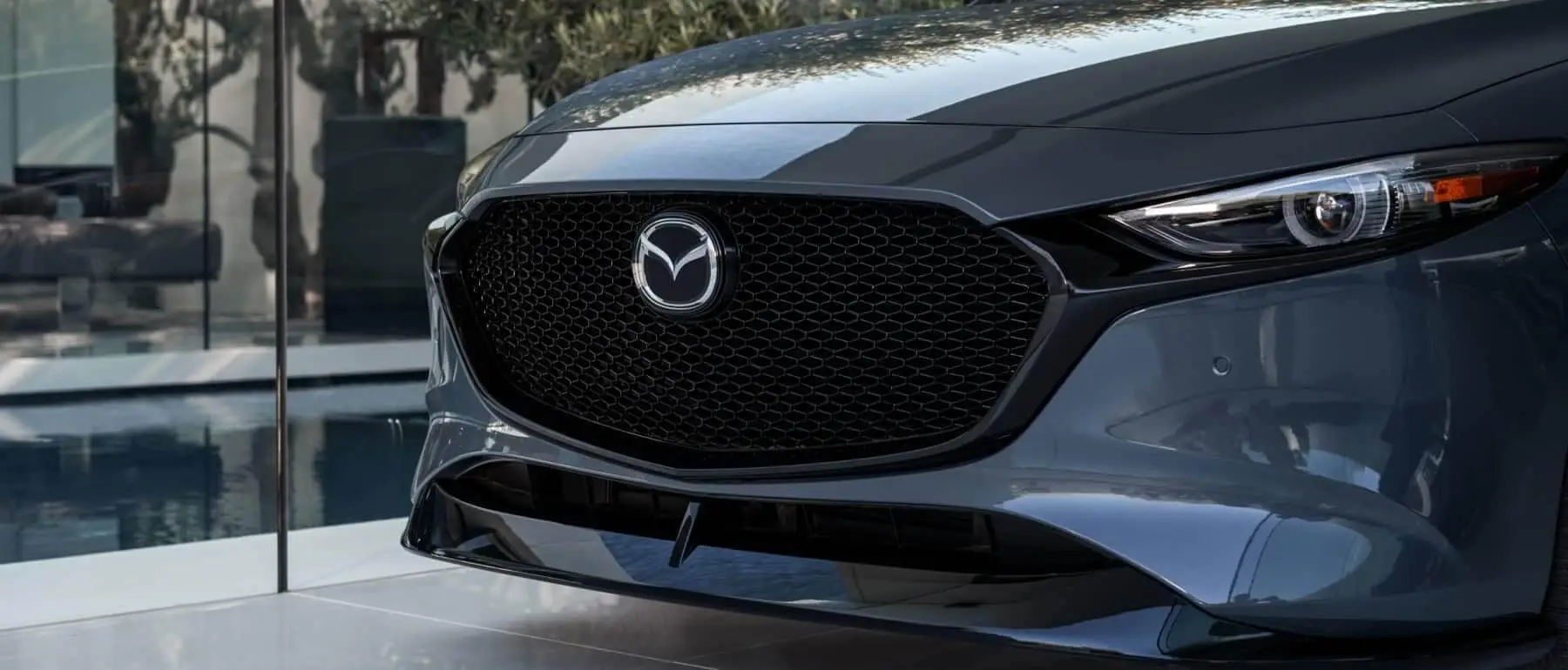 Schomp Mazda - grill of a Mazda Sedan