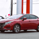 Nissan Versa in front of dealership