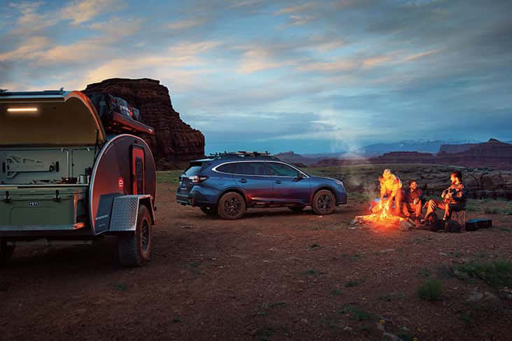 subaru suv with people camping