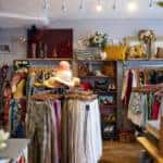 Interior Of Thrift Shop Selling Used And Sustainable Clothing And Household Goods