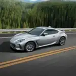 silver subaru brz driving down highway