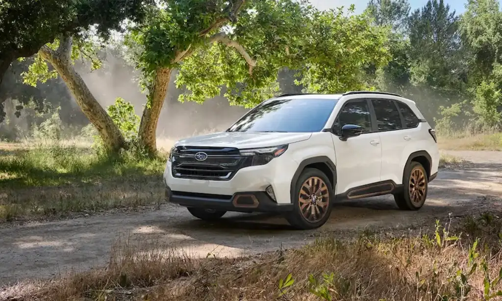 2025 Subaru Forester parked under trees