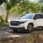 2025 Subaru Forester parked under trees