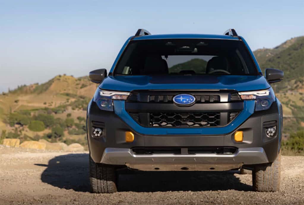 front of a blue 2027 subaru forester hybrid wilderness suv