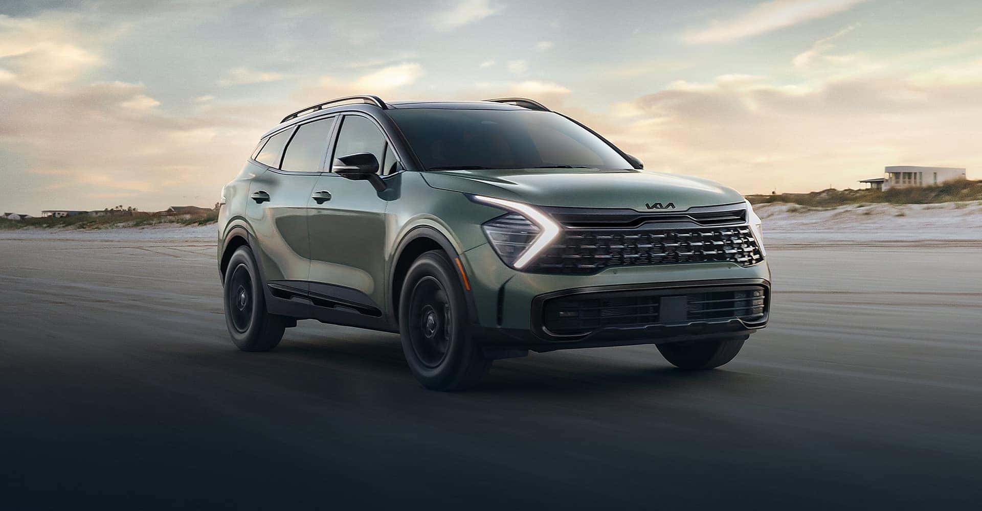 Kia Sportage driving sand