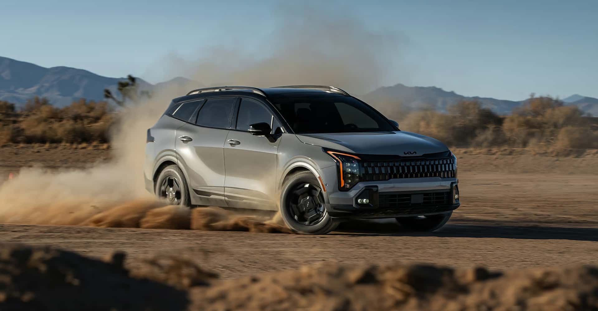 2026-Kia-Sportage-driving-on-dirt