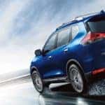Blue 2020 Nissan Rogue on Rainy Road