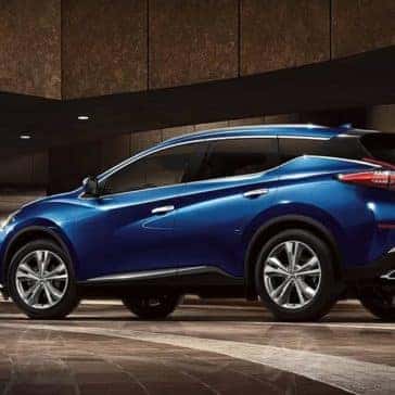 2020 Nissan Murano parked in front of a busy building at night