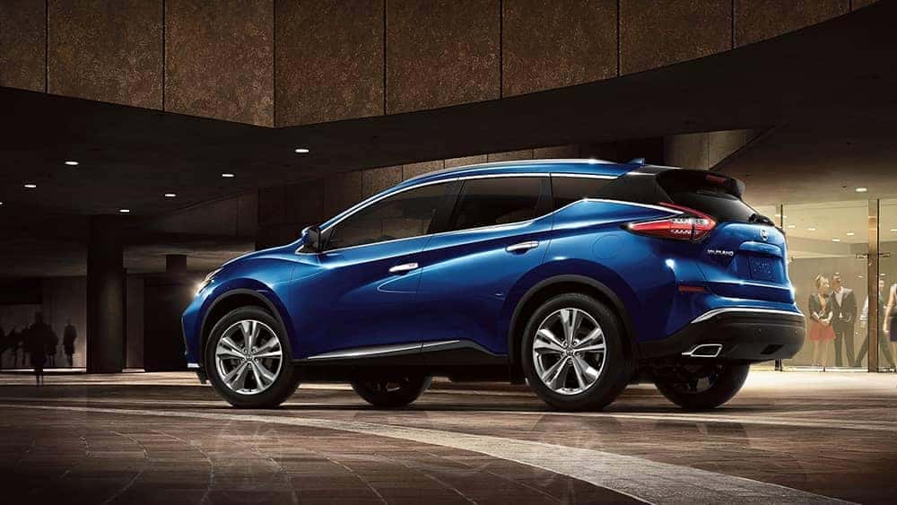 2020 Nissan Murano parked in front of a busy building at night