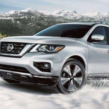 2020 Nissan Pathfinder driving in the snow in the mountains
