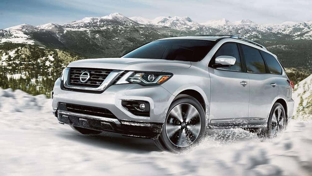 2020 Nissan Pathfinder driving in the snow in the mountains