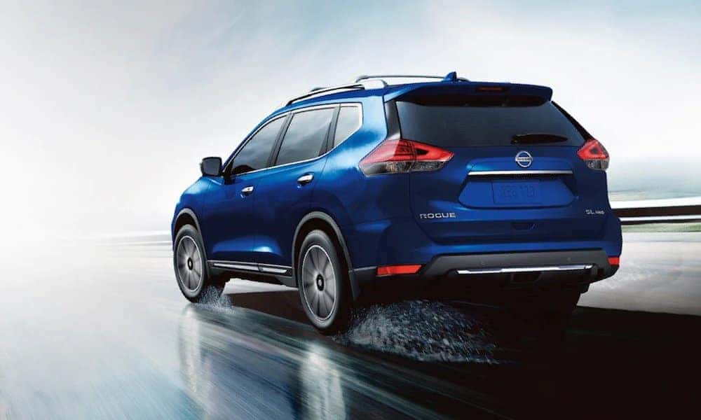 Blue 2020 Nissan Rogue on Wet Road