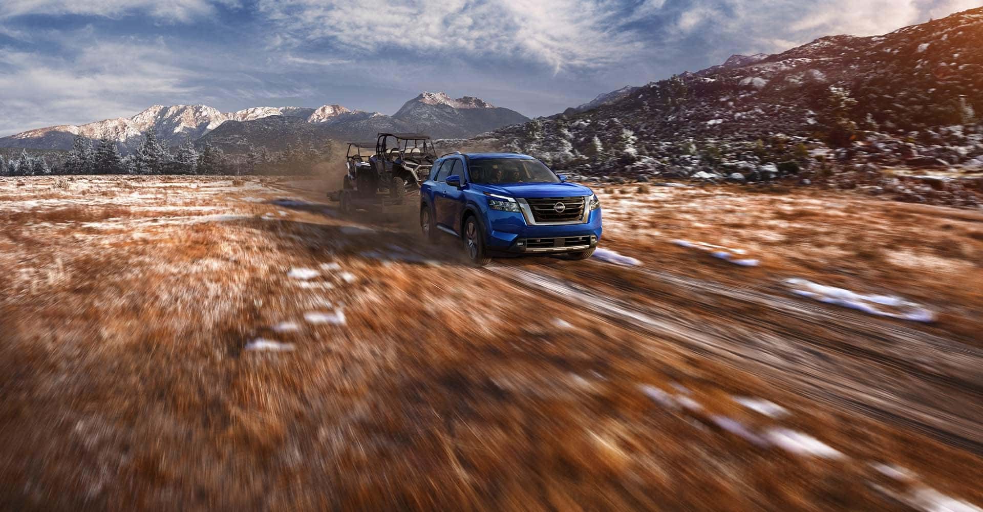 2025 Nissan Pathfinder driving through the mud