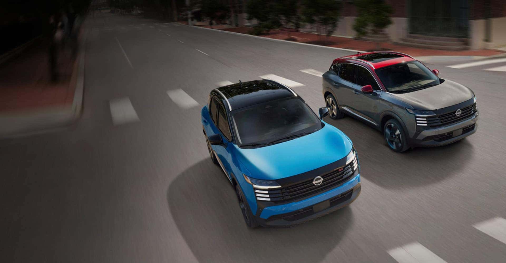 Nissan Kicks XLs Driving Next to Each Other