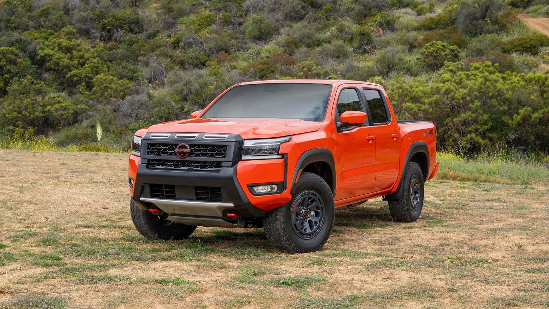 Oeange 2025 Nissan Frontier in Field