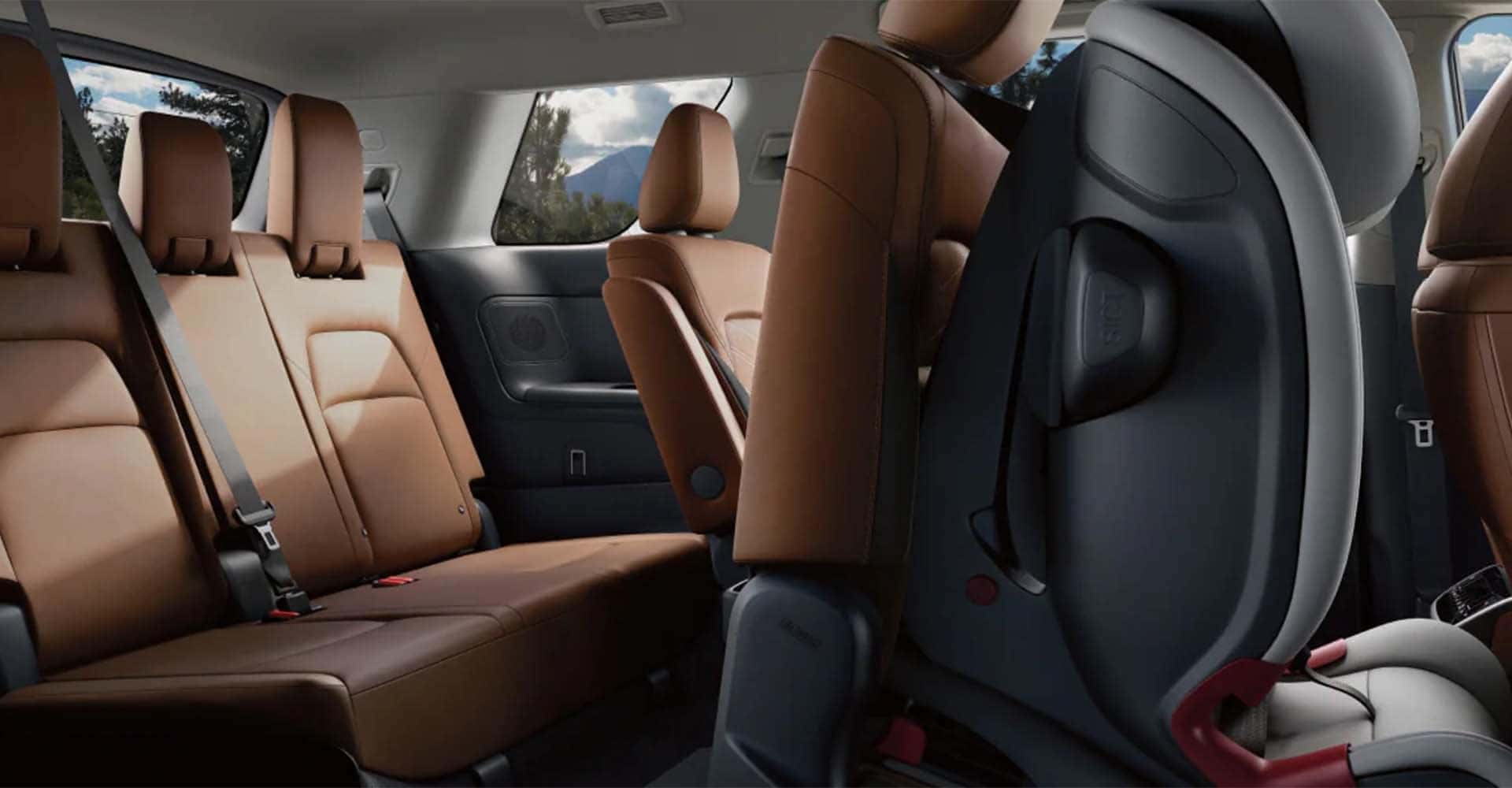 2025-nissan-pathfinder-interior-view-empty-child-seat-secured-2nd-row-seat