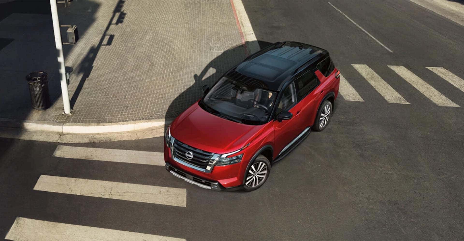 2025-nissan-pathfinder-view-from-above-turning-through-city-intersection