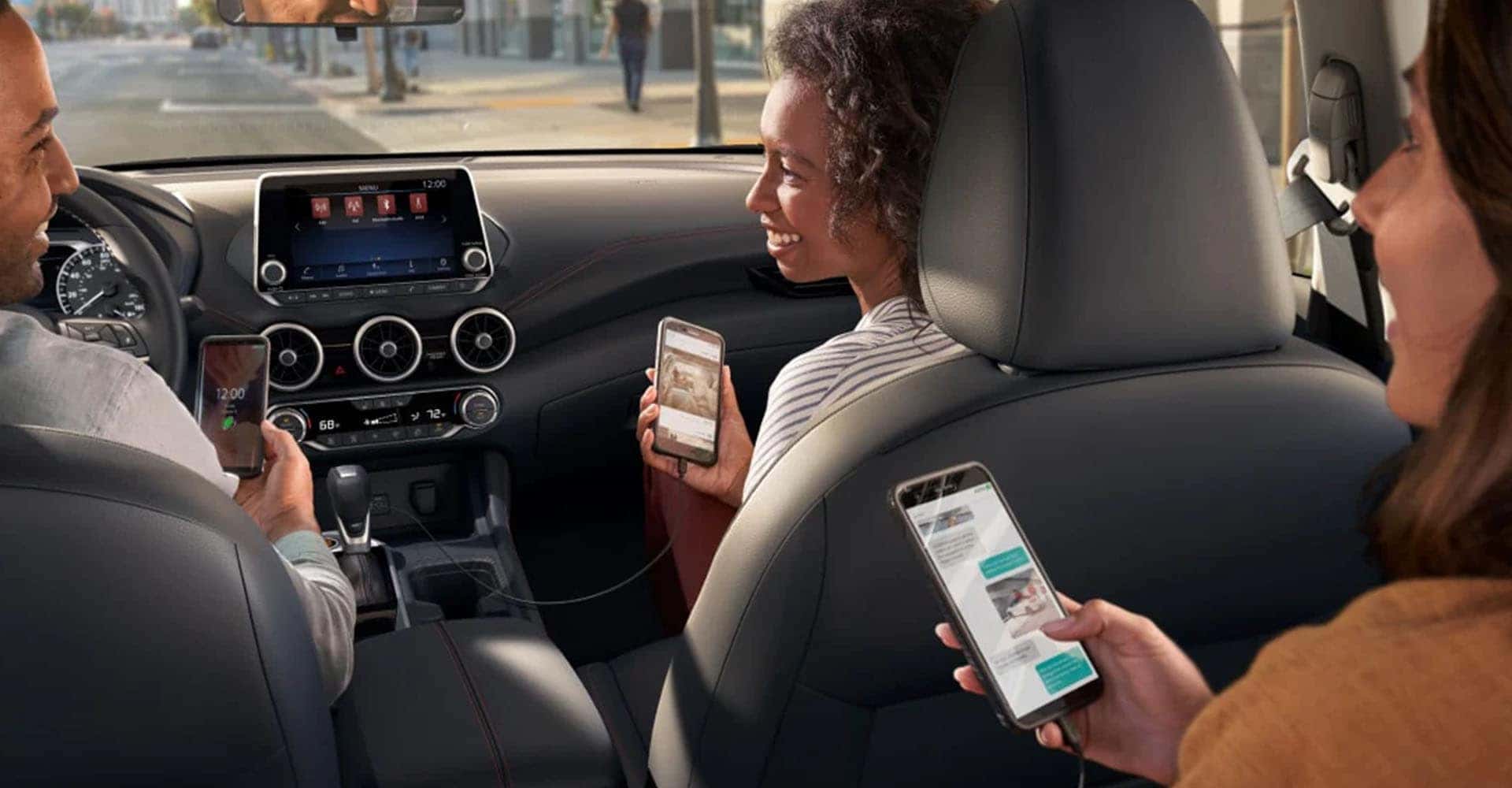 2025-nissan-sentra-interior-people-using-their-smartphones-show-device-connectivity