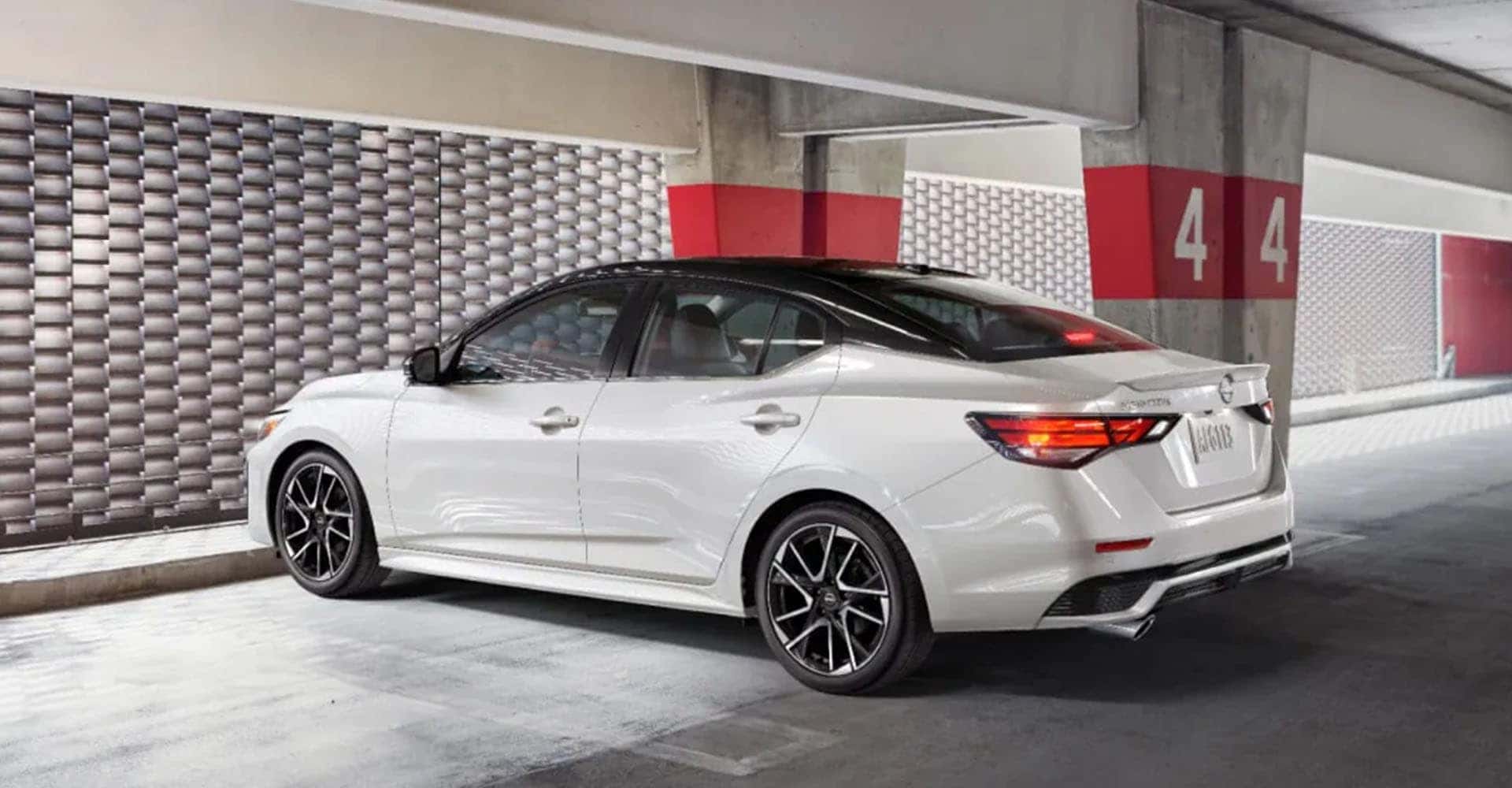 2025-nissan-sentra-white-parked-parking-garage