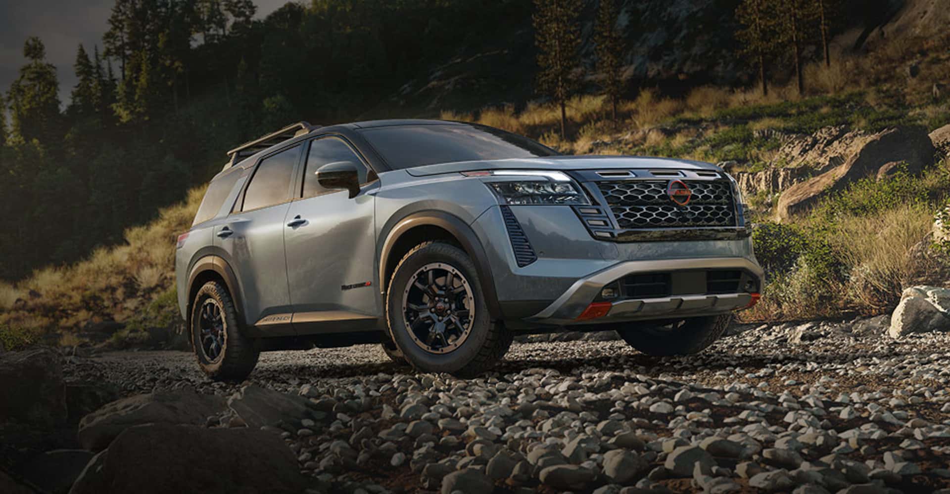 2026-nissan-pathfinder-driving-mountain-road-t-v2