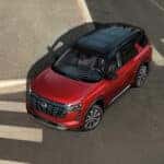 2026-nissan-pathfinder-red-exterior-crossing-city-intersection-top-view-lightbox-D