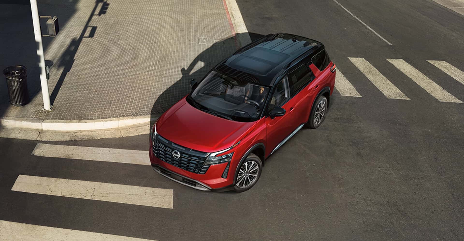 2026-nissan-pathfinder-red-exterior-crossing-city-intersection-top-view-lightbox-D