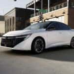 Side view driving 2026 Nissan Sentra white