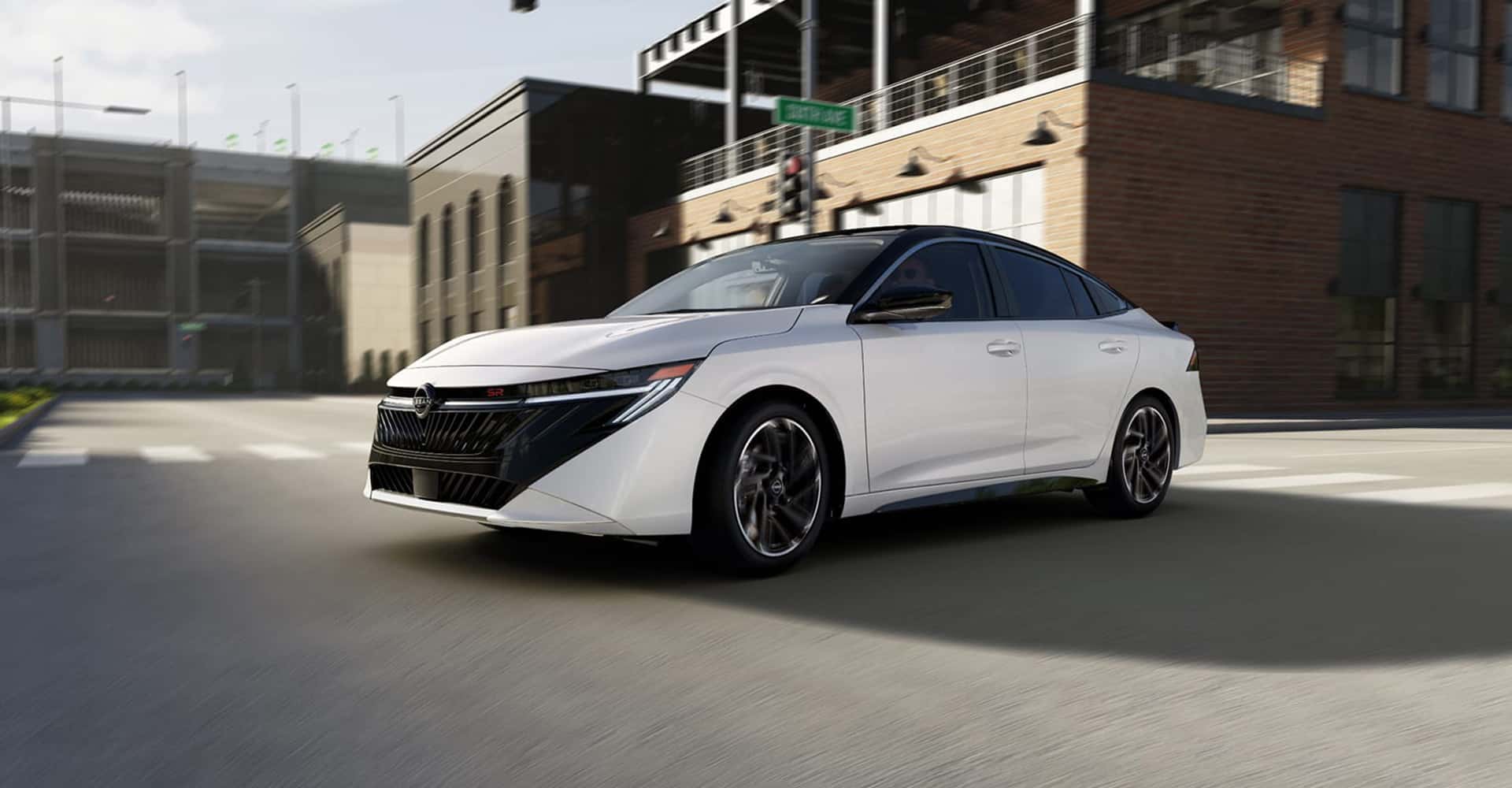Side view driving 2026 Nissan Sentra white
