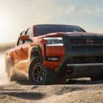 2026 Nissan Frontier dirivng through dirt road